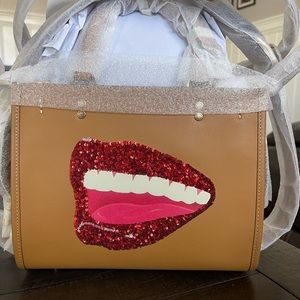 Brand new never used Coach rogue 25